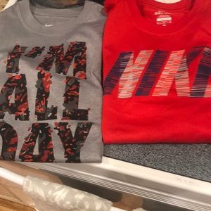 Two boys Nike dry fit shirts